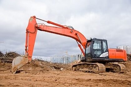 Excavator at a construction site in Vancouver secured by BestWORLD's professional security services.